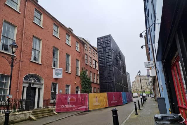 Containers in front of the former Convent of Mercy building on Pump Street.