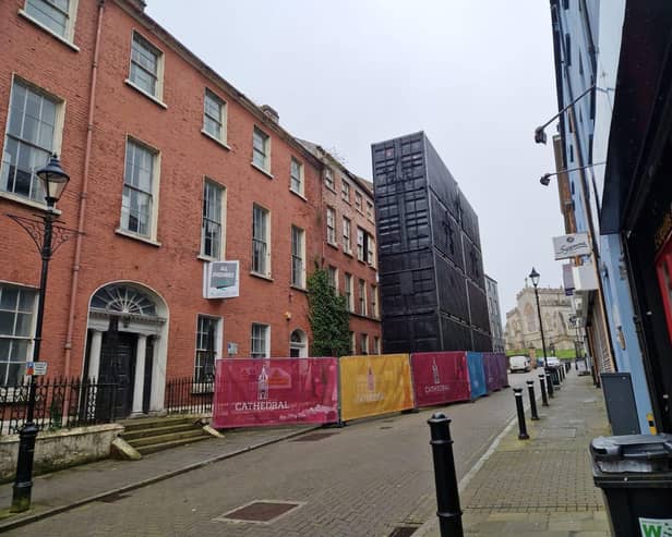 Containers in front of the former Convent of Mercy building on Pump Street.