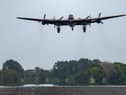The City of Lincoln Lancaster Bomber takes to the sky for the memorial flight of the 80th anniversary of the WWII Dambusters Raid at RAF Coningsby