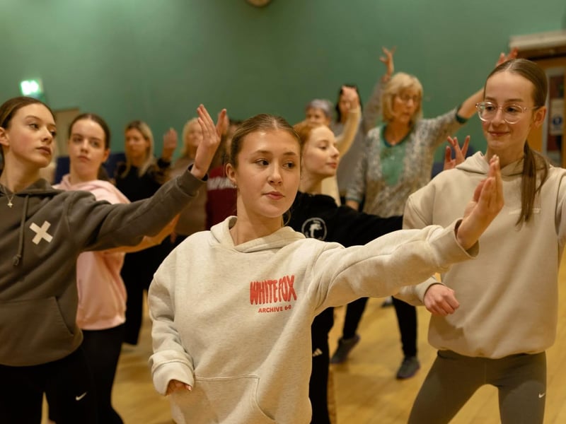Members of the ensemble in rehearsal for Oklahoma.