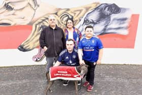 That Man pictured with the Coyle family; Charles, Claire & Shane and Nathan Coyle is holding the dog that is fondly & respectfully named in memory of his late grandfather.
