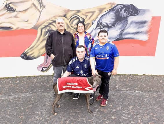 That Man pictured with the Coyle family; Charles, Claire & Shane and Nathan Coyle is holding the dog that is fondly & respectfully named in memory of his late grandfather.