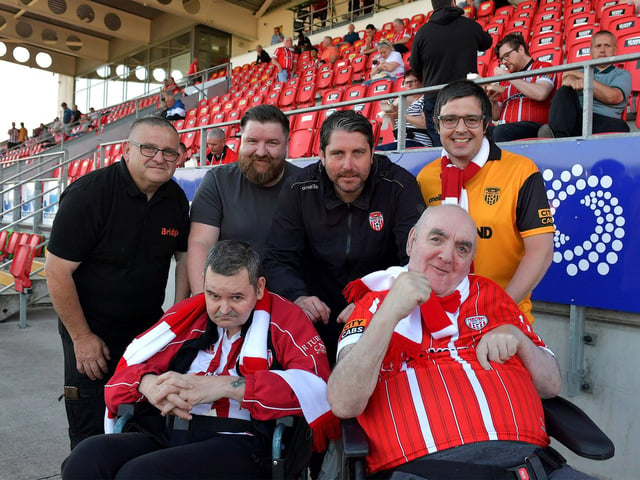 Mask a Wish winners, from Culmore Manor, Willie McLaughlin, former Derry City steward and Robert Montgomery pictured with Derry City manager Ruaidhri on Friday night. Included in the photos are Mark Harrigan, Ryan O’Donnell and Daniel McColgan. Photo: George Sweeney. DER2321GS - 56