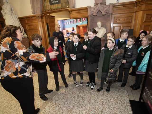 The Mayor, Patricia Logue explaining the history of the Guildhall to P5 pupils from Greenhaw PS during a visit to the Guildhall.