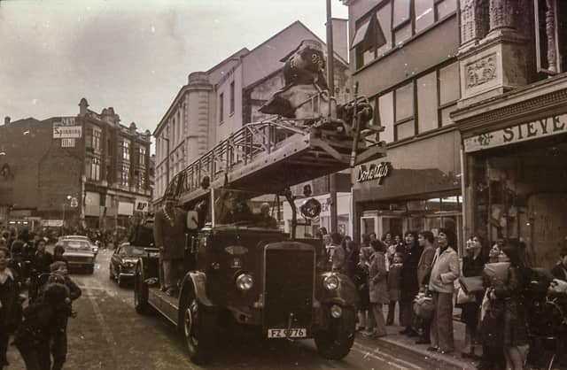 The Wombles' Great Uncle Bulgaria makes his way along Strand Road atop a fire truck to meet Derry children at the Embassy in an event organised by Holiday Projects.