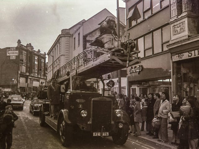 The Wombles' Great Uncle Bulgaria makes his way along Strand Road atop a fire truck to meet Derry children at the Embassy in an event organised by Holiday Projects.
