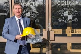 Mr Stephen Gallagher, principal of Loreto College, Coleraine, excitedly taking delivery of his new headgear
