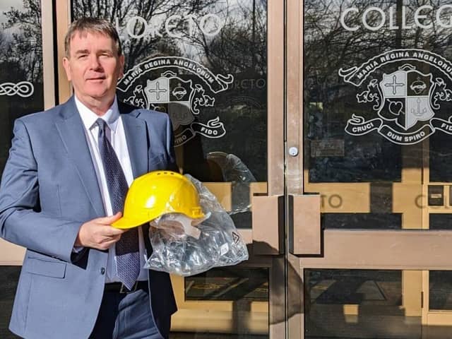 Mr Stephen Gallagher, principal of Loreto College, Coleraine, excitedly taking delivery of his new headgear
