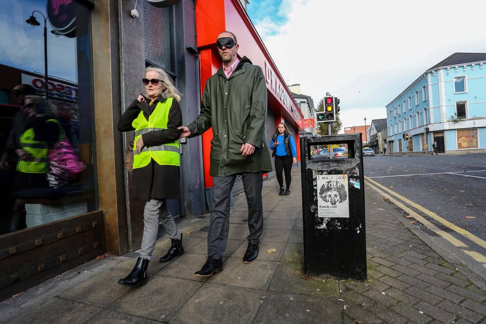 Mark Durkan, MLA, with an RNIB volunteer on the Strand Road.