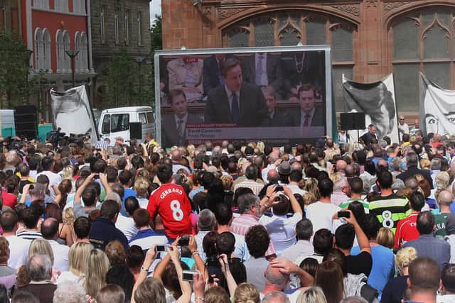 2010: The gathered crowd at Guildhall Square listen to the British Prime Minister David Cameron, addressing the House of Parliment on the Lord Saville Report on 'Bloody Sunday'. LS2410-515MT.