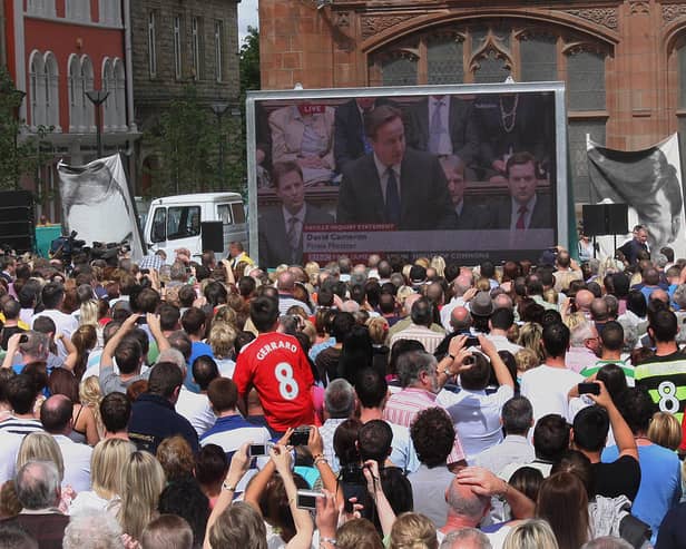 2010: The gathered crowd at Guildhall Square listen to the British Prime Minister David Cameron, addressing the House of Parliment on the Lord Saville Report on 'Bloody Sunday'. LS2410-515MT.