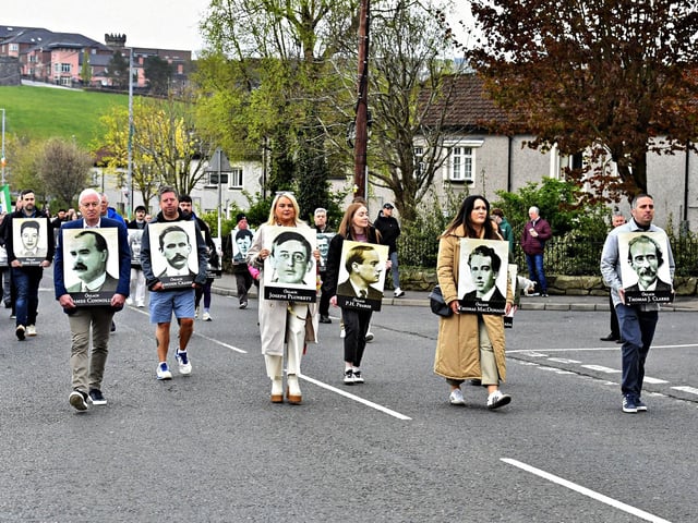 Sinn Fein councillors carry photographs of some of the leaders of the 1916 Easter Rising during Sunday afternoon’s commemoration in Derry. Photo: George Sweeney