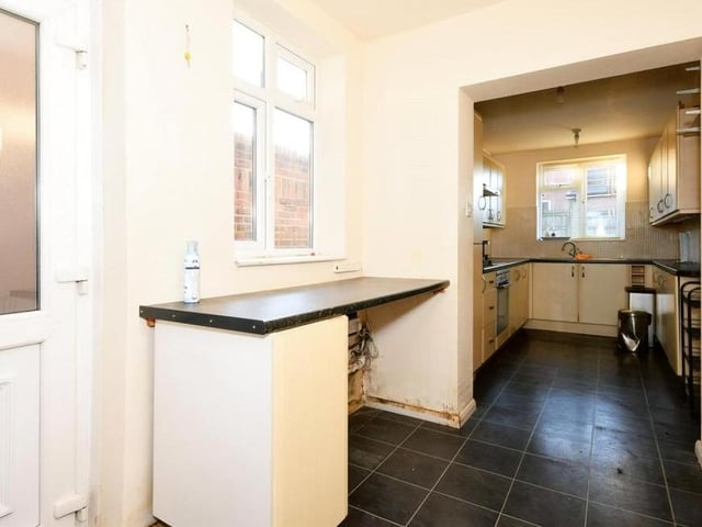 The kitchen also features this utility space, which is sure to come in handy.