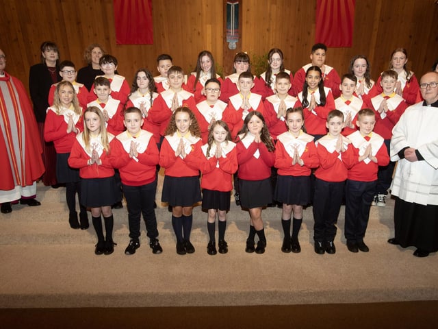 STEELSTOWN PS CONFIRMATION. . . .Children from Mrs. O'Donnell's class at Steelstown Primary School who received the Sacrament of Confirmaton from Monsignor Donnelly at Our Lady of Lourdes Church, Steelstown on Tuesday evening last. Included is Fr. McDevitt, Adm., Steelstown, Catherine Doorish, Principal, and Victoria O'Neill, Vice Principal. (Photo: Jim McCafferty Photography)