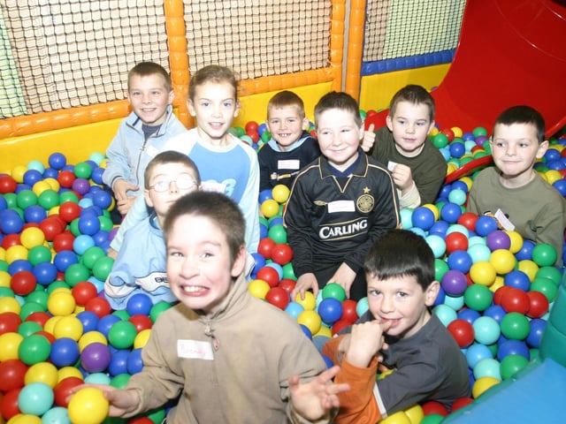 Nathan surrounded by his friends in the ball pool at The Fun Factory, at his ninth birthday party.:Parties and nights out in Derry and Donegal in December 2003.