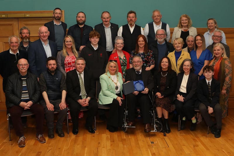 Mayor Sandra Duffy making a presentation to sculptor Maurice Harron, in recognition of his contribution as an art educator and artist in the City and District at a civic reception held in the Guildhall. Included are friends and family.  (Photo - Tom Heaney, nwpresspics)