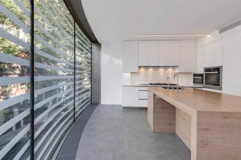 The bulletproof structural glass façade is the building’s most distinctive feature.