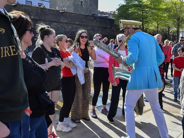 Will Lenton from Mr Wilson’s Second Liners entertains fans in Guildhall Square. Photo: George Sweeney
