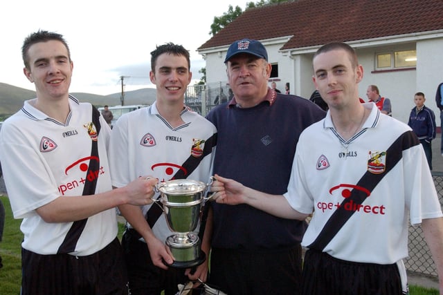 The Hinphey clan, Kevin, Liam Og, Liam snr and Ciaran pictured with the Fr. Collins Cup after defeating Ballinascreen in Banagher back in 2003.