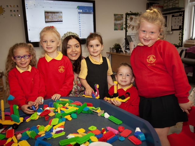Mrs. Neidin Kelly pictured with some of her new primary 1 pupils this week.:.