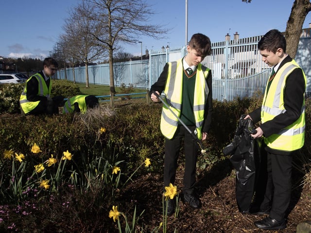 Pupils from St. Joseph's Boys School taking part in Wednesday's clean-up of the area around the school.