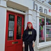 Hannah Vail in front of Han* store