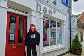 Hannah Vail in front of Han* store