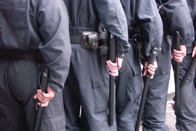 Ready for action. RUC men with batons at ready 12th confrontation 2005.