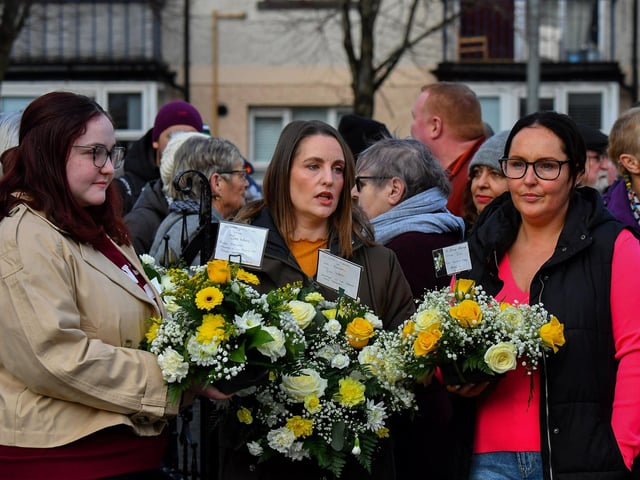 Relatives of those murdered on Bloody Sunday carry floral tributes at the annual service held on Sunday morning. Photo: George Sweeney