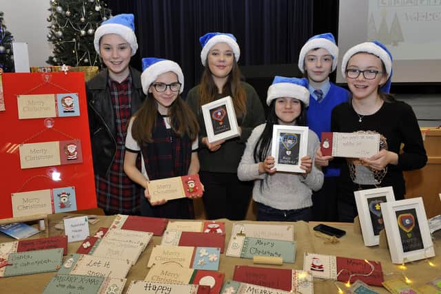 St Mary’s College art entrepreneurs from ‘Room 13’ pictured at their seasonal decorations stall at a previous annual Christmas Craft Fair held in the school. From left are Olivia McMonagle, Abigail Hagan, Demi Casey, Chantelle Harcort, Aoife Henry and Felicity Beardwood. DER4815GS028