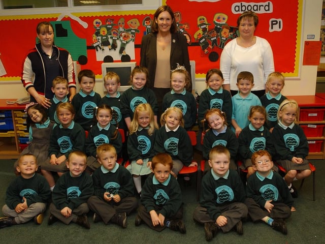 Primary 1 pupils from Oakgrove Primary School with, back row from left, Roberta Martin, classroom assistant, Kathy Laverty, vice principal, and Paula Feathers, classroom assistant. (1909PG18):20 years on: Young people across Derry and Donegal starting school in September 2003