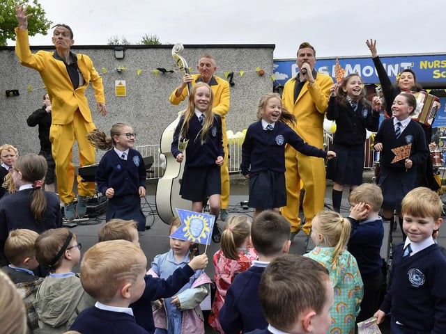 Pupils from Rosemount Primary School sing with the Jive Aces during the band’s visit to the school on Thursday morning. Photo: George Sweeney
