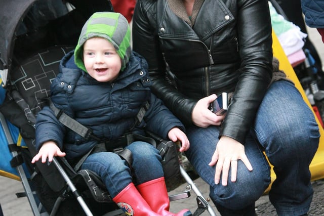 Young TJ McCabe and mum Denise pictured enjoying the floats during Sunday's St. Patrick's Day parade in Buncrana. 1903JM47