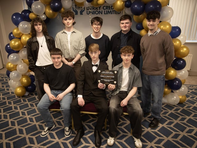 Derry Credit Union's Young People's Awards 2025 nominees the Liturgy and Choir Group, St. Columb's College, being presented with their certificates by Gary McLaughlin, Youth Committee, on Monday night.