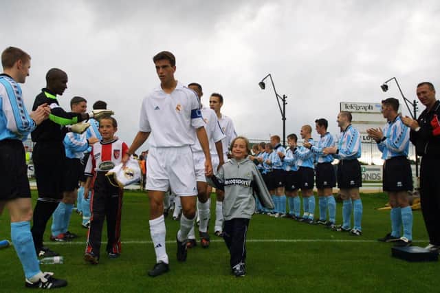 Real Madrid captain gets a warm welcome by the Derry City players.(2208JB70)