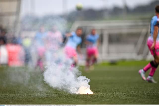 A general view of a flare after being thrown onto the pitch during the SSE Airtricity Men's Premier Division match between Derry City and Bohemians at The Ryan McBride Brandywell Stadium in Derry. Photo by Ramsey Cardy/Sportsfile