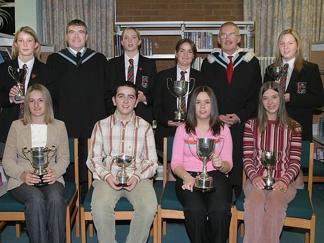 Pupils who collected awards at Clondrmot HIgh Schools annual Prize-Giving.  Seated (from left), Laura Hutchinson, cup for Fieldwork in Geography, Ross Shields, English cup, Kimberley Downey, cup for IT and Laura Hawthorne, Science cup.  Standing (from left), Stephanie Olphert, cup for General Excellence in Year 13, David Funston, vice-principal, Amy Rutherford, Young Enterprise cup in Year 13, Stacey-Lea Jackson, Hockey cup, Robert Logue, vice-principal, and Deborah Hawthorne, Georgraphy cup. (2810T08).:Derry and Donegal secondary school pupils in October 2003
