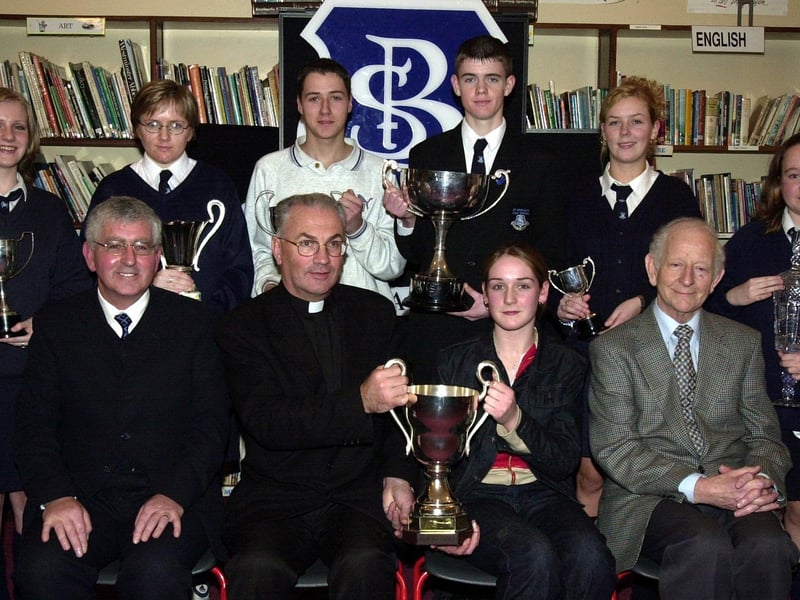 Fr. Aidan Mullan, P.P., Waterside, presenting the Desmond Cup for Academic Excellence to Tracey McCay. Included at front are Mr. Paul Molloy, principal, and Mr. Joe Fagan, board of governors. Back, from left, are Deborah McFadden (Civic Award), Michelle McGowan (Community Service), James Boyle (Contribution to School Life), Martin Starrett (Most Committed Student), Sheila Kerrigan (Work Experience Cup) and Claire O'Kane (Best Work Experience). (1/12/CD11) : Pictured are students, staff and invited guests at the annual school prize-giving at St Brecan's High School, Top of the Hill back in the year 2000.