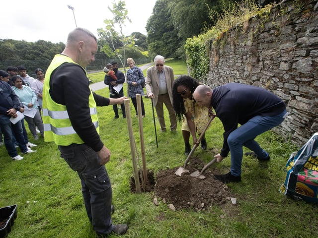 The Mayor, Lilian Seenoi-Barr and Mark Durkan, MLA plant the first of three oak trees on behalf of the citizens of Derry and the pupils of St. Columb's College at Saturday's Memorial Tree Planting in St. Columb's Park in memory of Reuven and Sebastian.