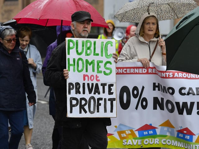 Participants carry placards during the Derry Housing Action Committee protest march over housing crisis on Saturday afternoon Photo: George Sweeney