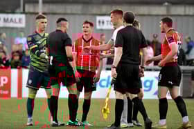 Derry City players approach referee Rob Hennessy after the final whistle. DER2321GS - 