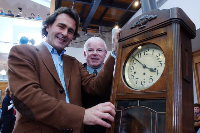 Paul Martin examines a grandfather clock brought along to Flog It!