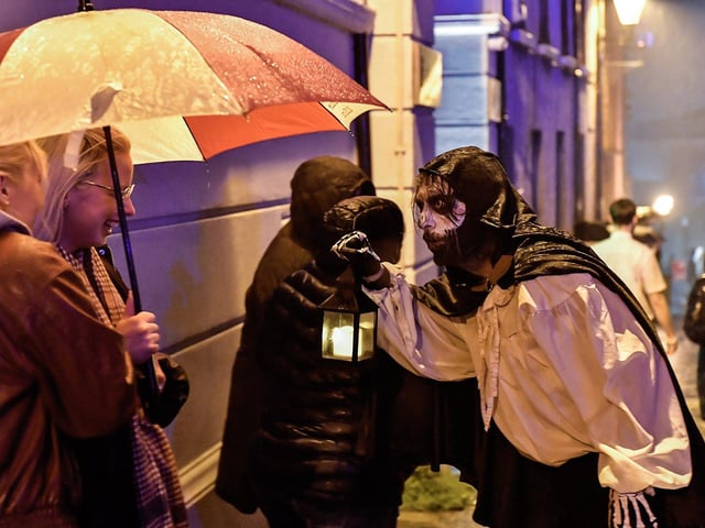 Revellers and performer on Artillery Street. Photo: George Sweeney