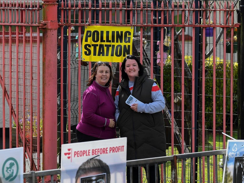 Canvassers outside the Holy Child Primary School polling station. Photo: George Sweeney