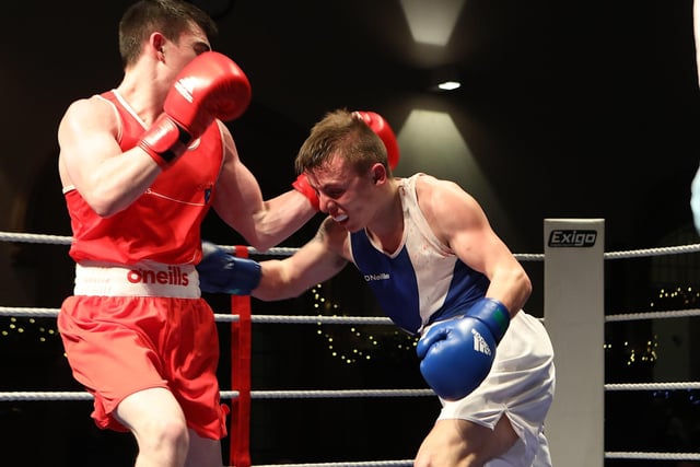 Tiarnan Glennon (St. Joseph's ABC) lands a right on his opponent Padddy McShane (Letterkenny ABC), winner of the Male 57 kg special event. (Photo - Tom Heaney, nwpresspics)