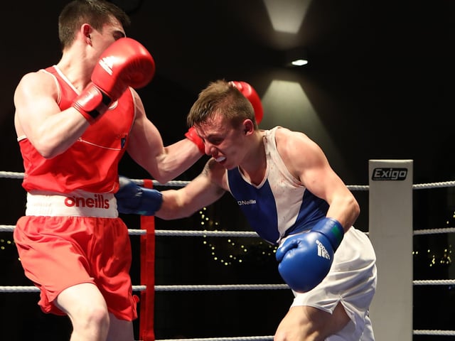 Tiarnan Glennon (St. Joseph's ABC) lands a right on his opponent Padddy McShane (Letterkenny ABC), winner of the Male 57 kg special event. (Photo - Tom Heaney, nwpresspics)