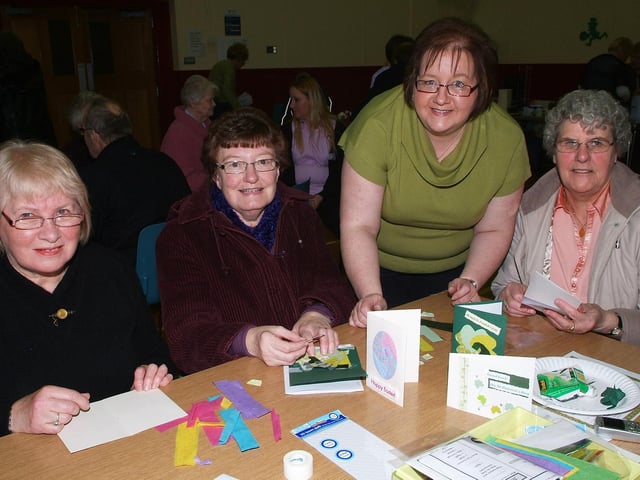 Making St. Patrick's Day cards at the Celebration of St. Patrick event held by the Shared City Project and Derry City Council Community Relations on Saturday were, from left, Olive Davis, Irene Laird, Diane Guthrie, tutor, and Lena Nicholl. LS12-113KM
