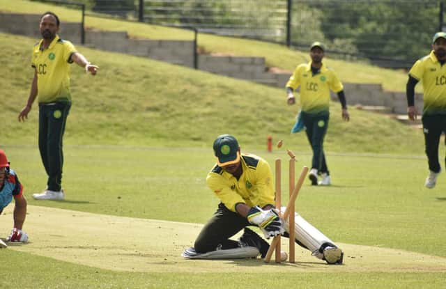Newbuildings' Hanu Viljoen is run out but the Letterkenny wicketkeeper dropped the ball and the decision was rightfully overturned.