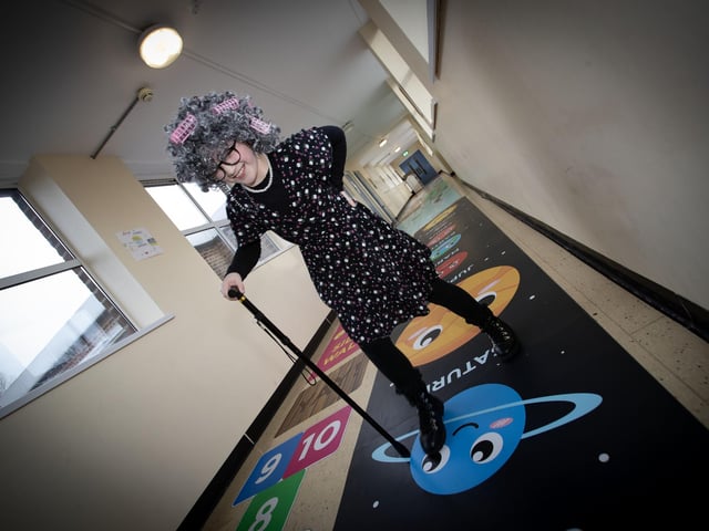 The ghost of an old teachers meanders through the corridors at Model PS on Thursday.