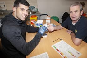 Local Creggan man Seamus Breslin gets a cholesterol check with the OLT’s Jonathan Peberdy during Saturday’s Men’s Health Checks at the Old Library Trust, Creggan. The event was part of the Communitities In Transition Programme. (Photos: Jim McCafferty Photography)